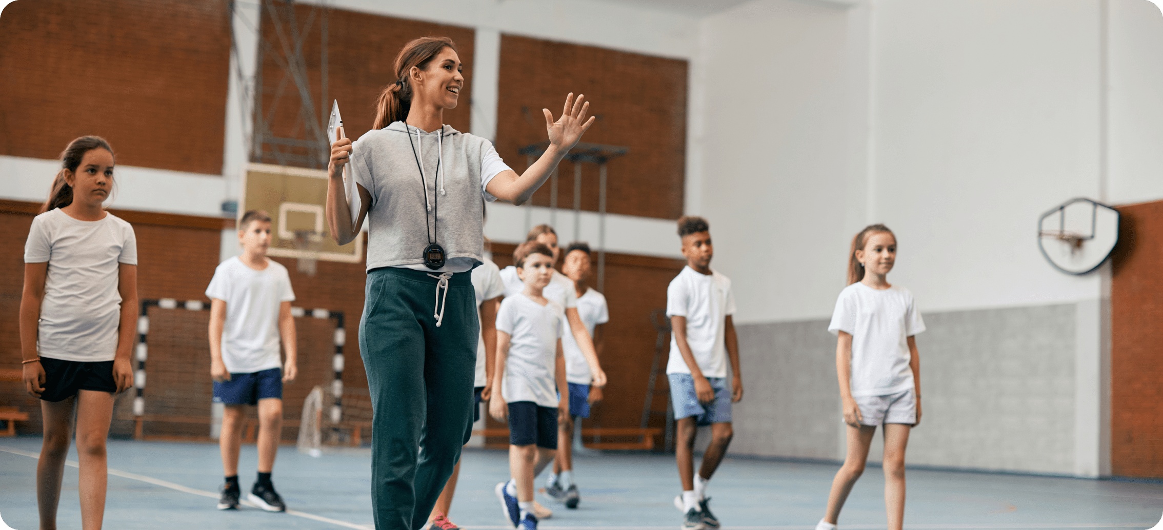 Coach guiding youths in a sport